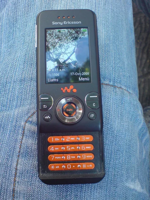 A black Sony Ericsson W580i with its keypad slid open