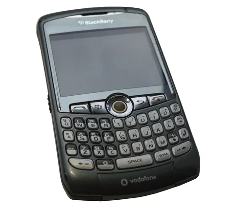 A grey BlackBerry Curve 8310, angled view of the keyboard